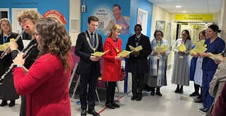 Carol singing with staff and patients